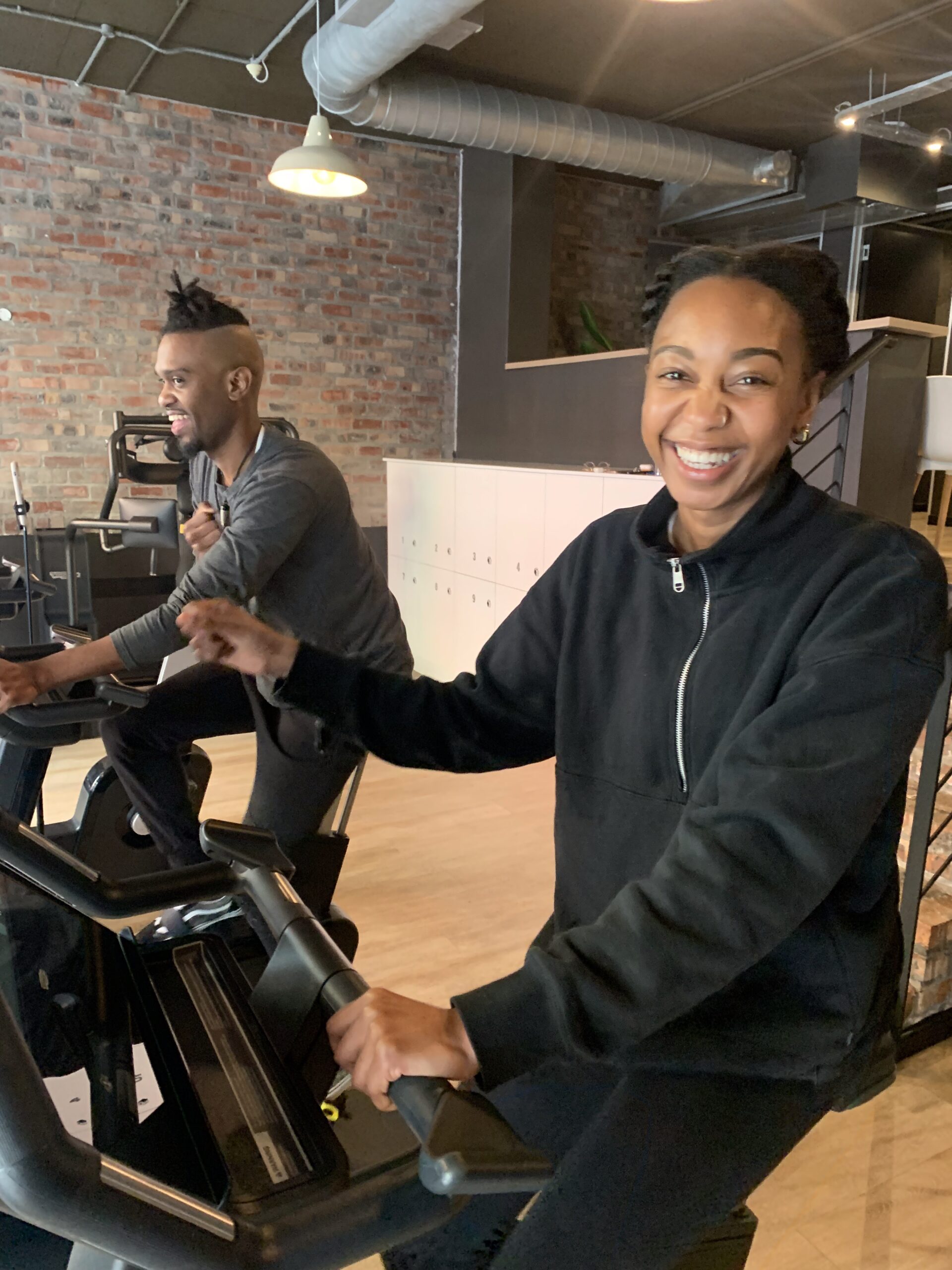 Threezero members on cardio bikes